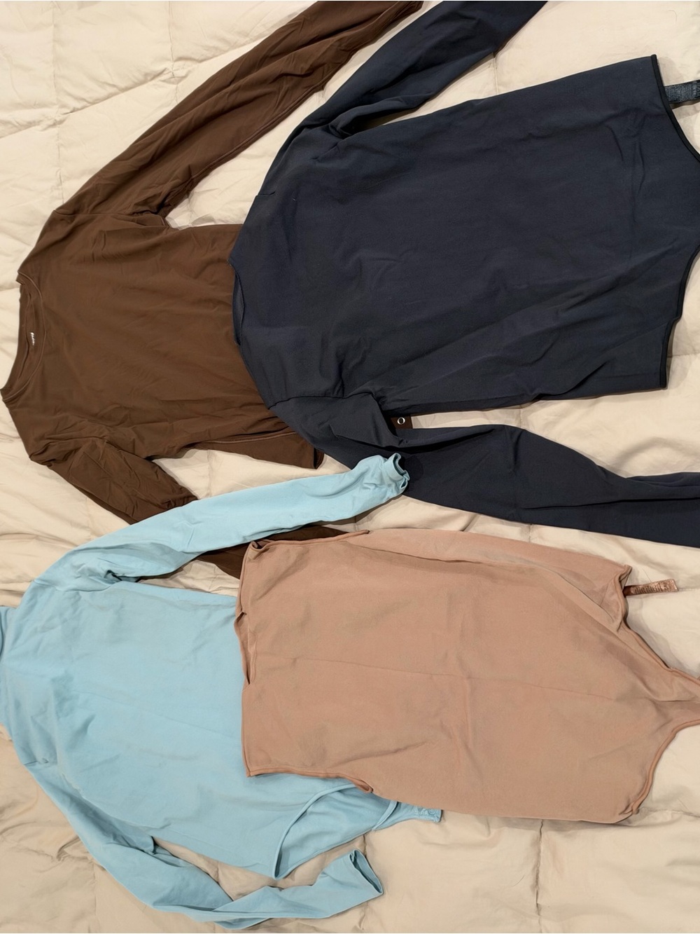 SKIMS Long Sleeve Bodysuits in Brown, Black, Light Blue, and Beige- S/M